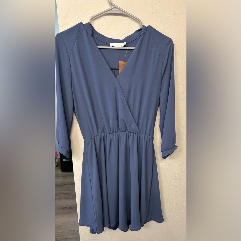 3/4 sleeve, mid length dress (slightly above the knee)